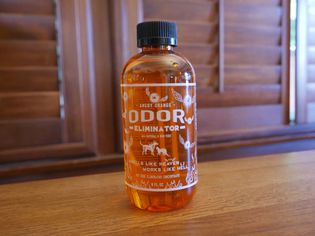 Angry Orange Pet Odor Eliminator displayed on a wooden table