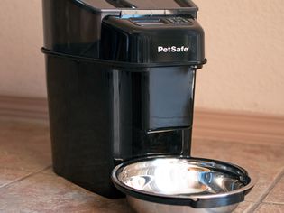 PetSafe Healthy Pet Simply Feed Automatic Feeder displayed on tile flooring