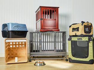 Stacked dog crates we recommend displayed on a wooden floor