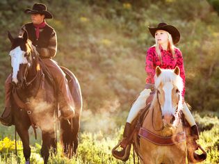 Cowgirl riding horse