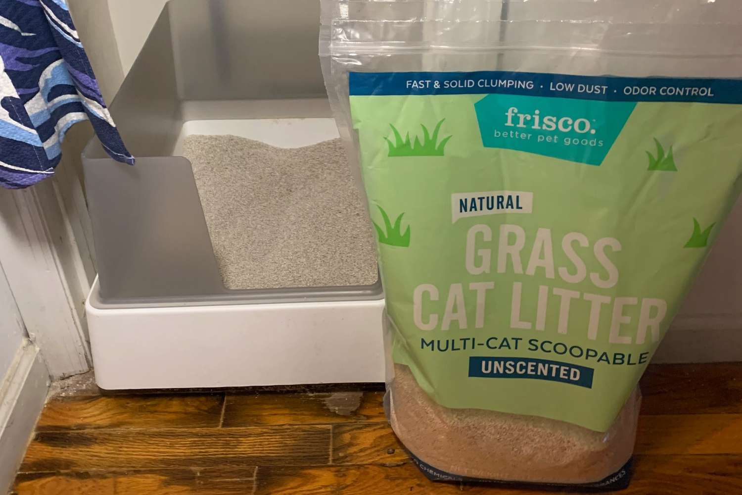 A bag of Frisco's Natural Unscented Clumping Grass Cat Litter